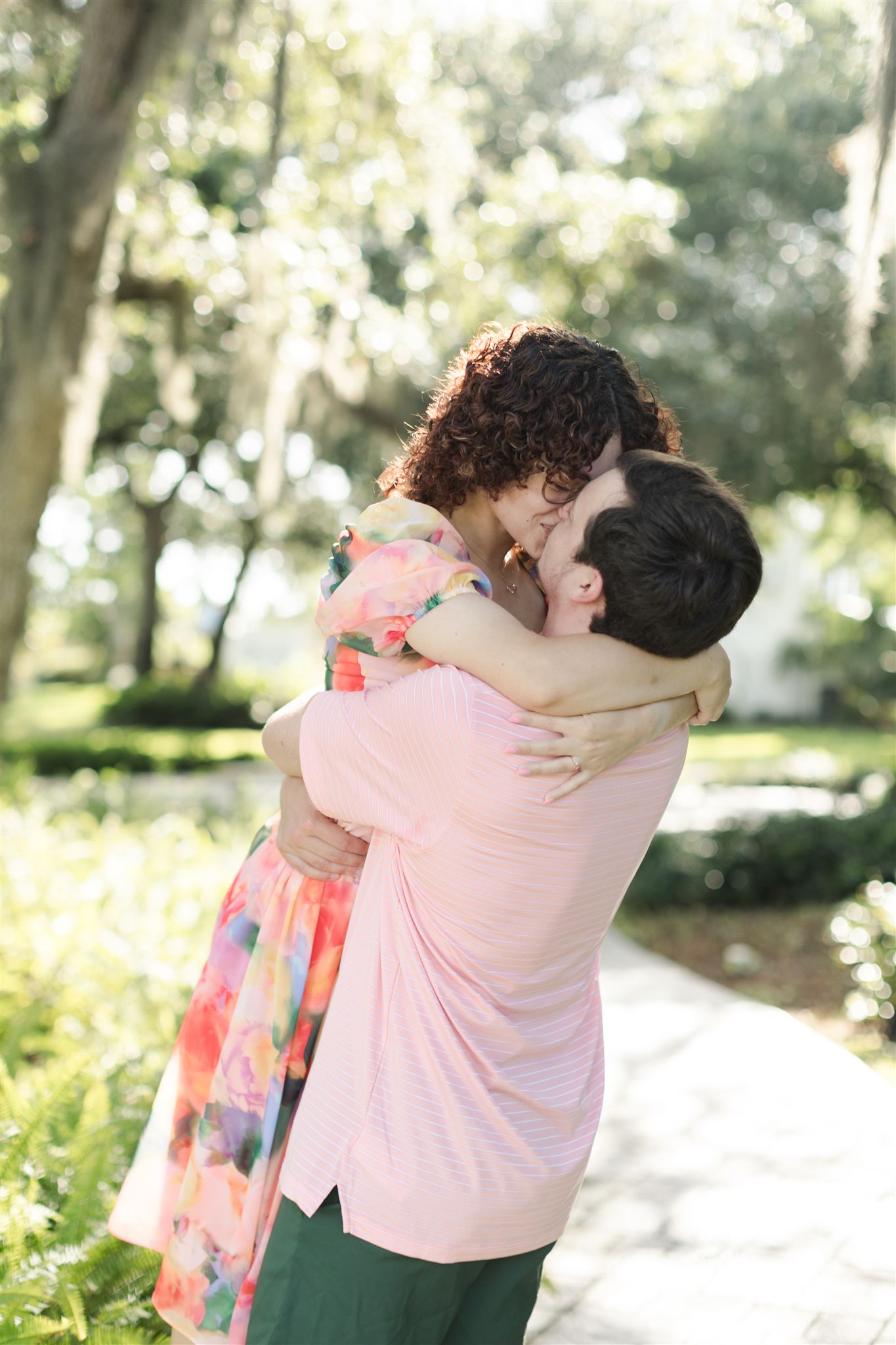 Couple kissing under Spanish moss at Up the Creek Farms, captured by Nassimbeni Photography.